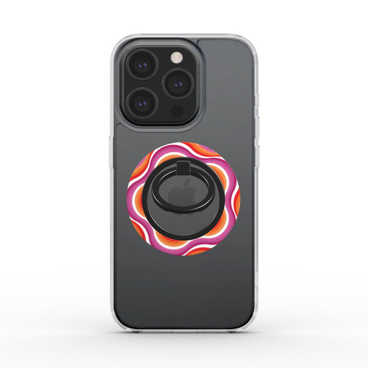 Ring holder magnetico applicato su iPhone con cover trasparente, design astratto pop in toni rosa, arancio e rosso, ispirato a onde concentriche.